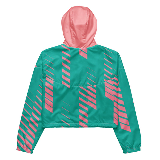 Back view of Teal and pink cropped windbreaker jacket with a half-zip front, a pink hood, and a diagonal geometric stripe pattern across the front and sleeves|IslandWear Fashion