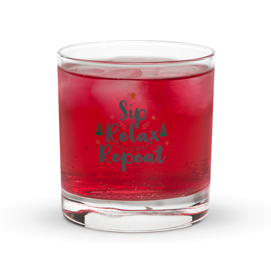 Clear, heavy-bottomed rocks glass or whiskey tumbler with a festive "Sip Relax Repeat" graphic, Christmas trees, and star.