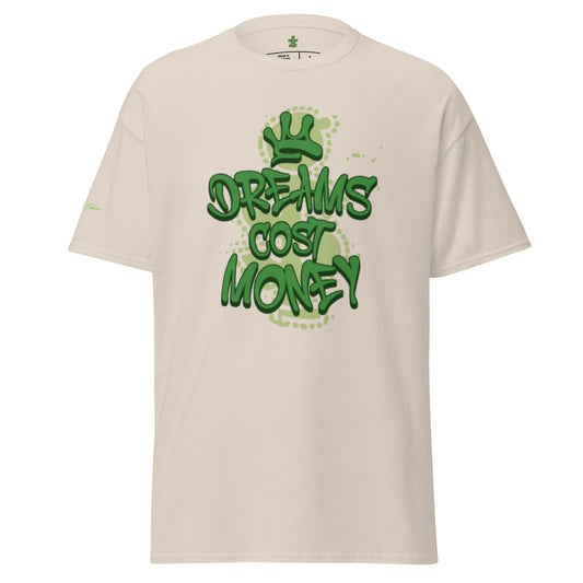 Beige/Natural unisex t-shirt featuring a streetwear graphic that reads "Dreams Cost Money" in bold, textured light green letters, overlaid on a faded money sign symbol. The design has white splatter accents.