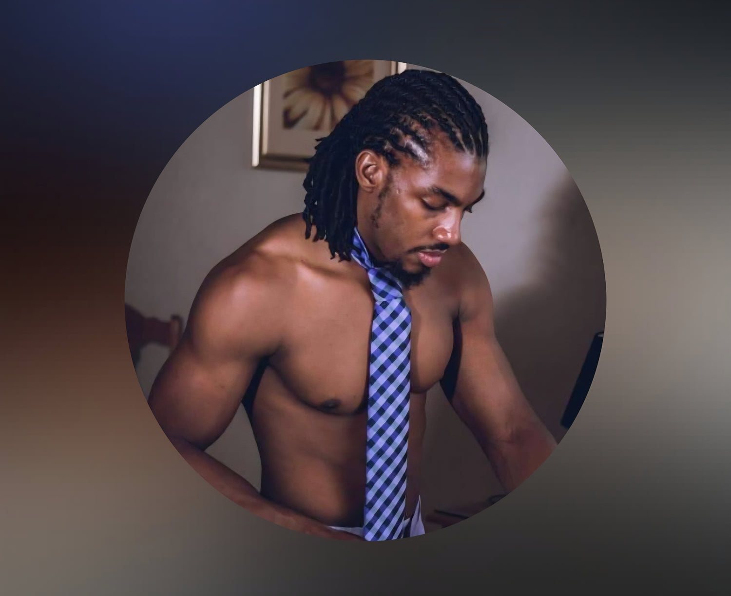 Man with braided hair wearing a blue checkered tie against a neutral background| IslandWear Fashion 