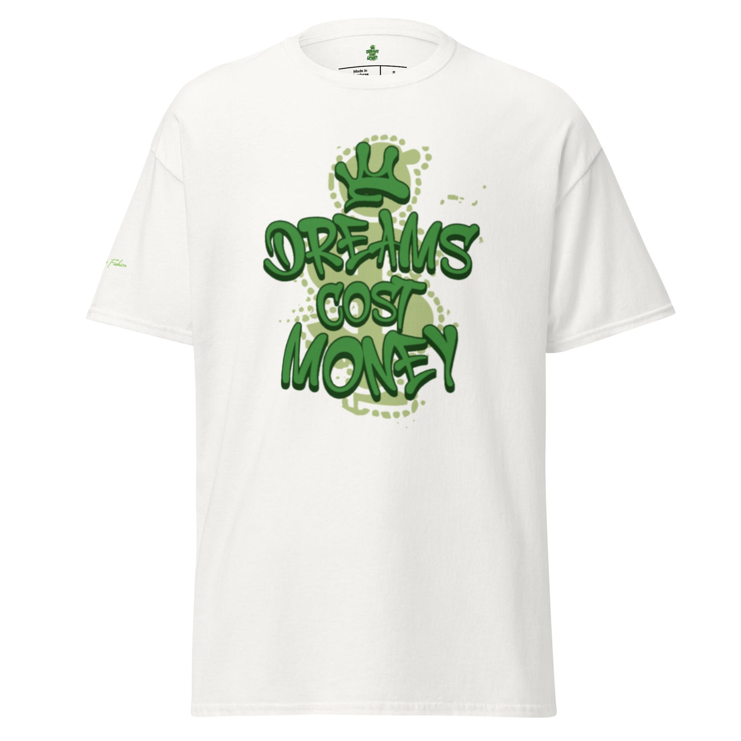 White unisex t-shirt featuring a streetwear graphic that reads "Dreams Cost Money" in bold, textured light green letters, overlaid on a faded money sign symbol. The design has white splatter accents.