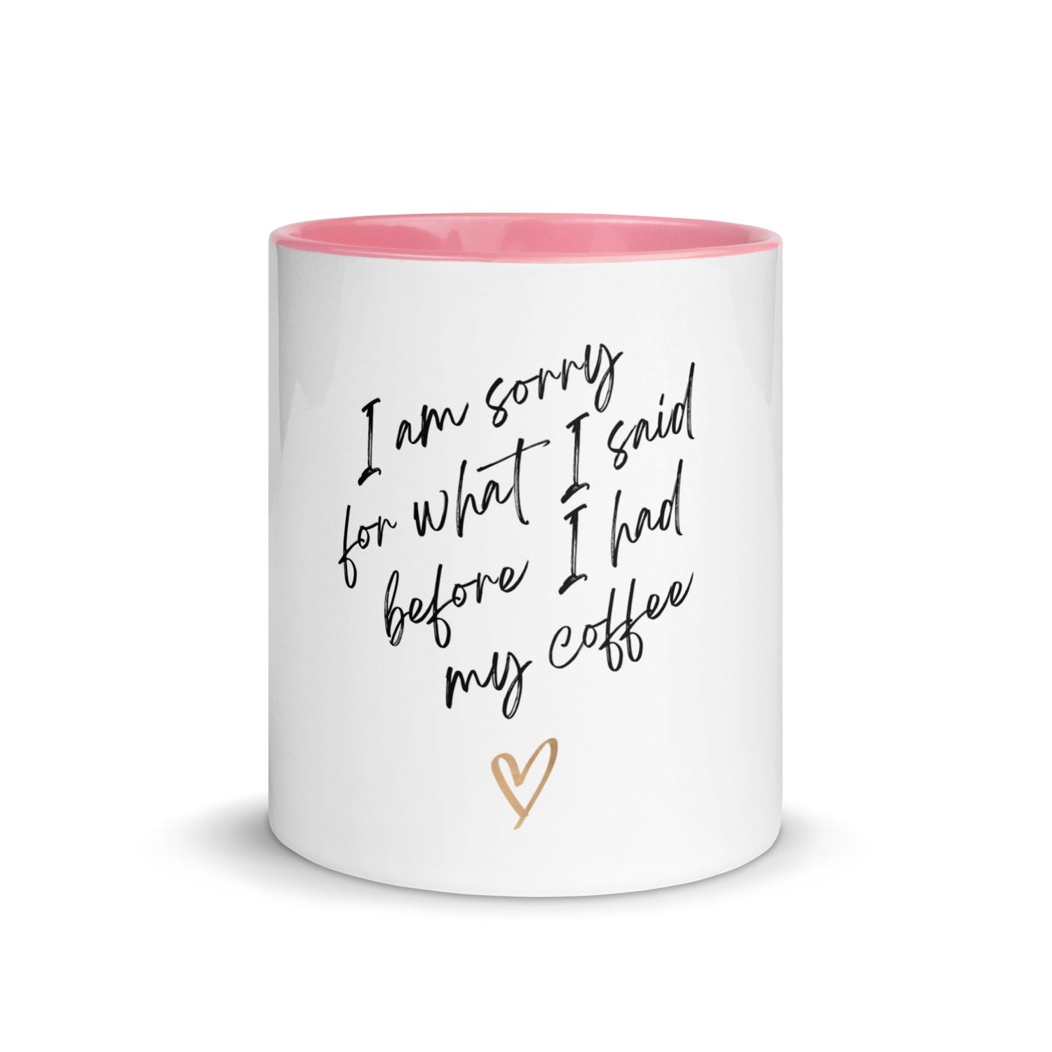 White mug with pink interior and text 'I am sorry for what I said before I had my coffee' on a white background