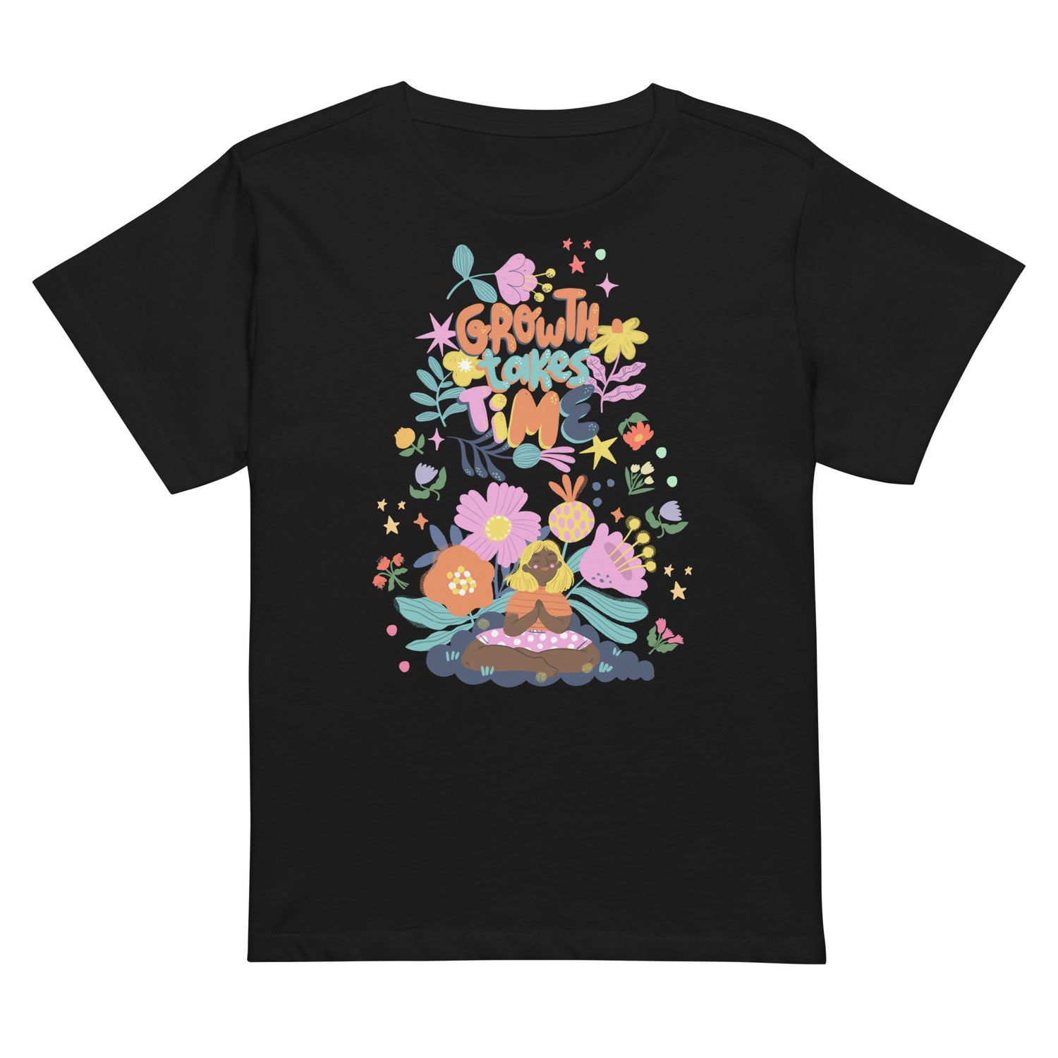 Black t-shirt with a colorful boho-floral graphic and the phrase "Growth Takes Time." Design shows a person meditating surrounded by flowers and stars.