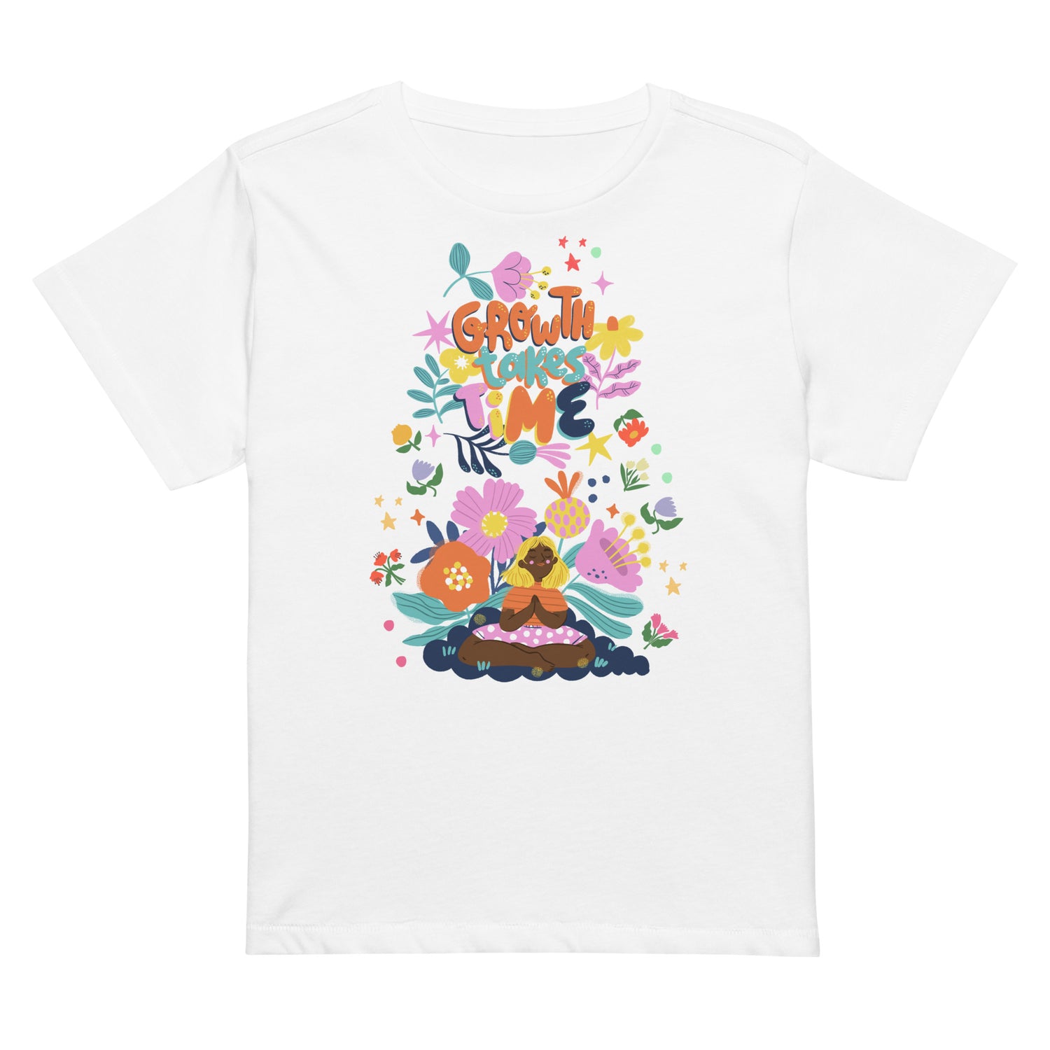 White t-shirt with a colorful boho-floral graphic and the phrase "Growth Takes Time." Design shows a person meditating surrounded by flowers and stars.